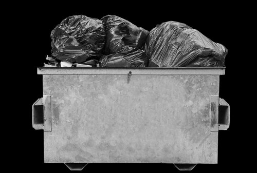 Workers sorting materials at a local transfer station in Hendon area